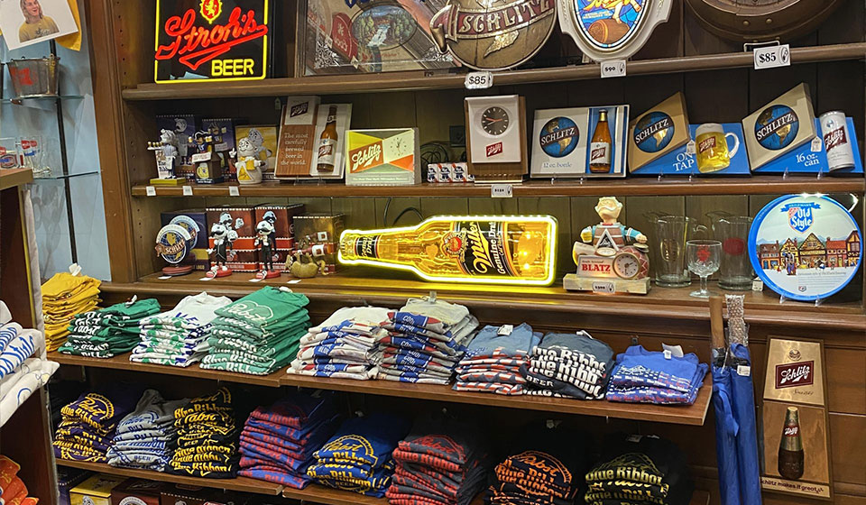 Pabst, Schlitz, and Blatz merchandise and vintage beer signs in the Best Place gift shop